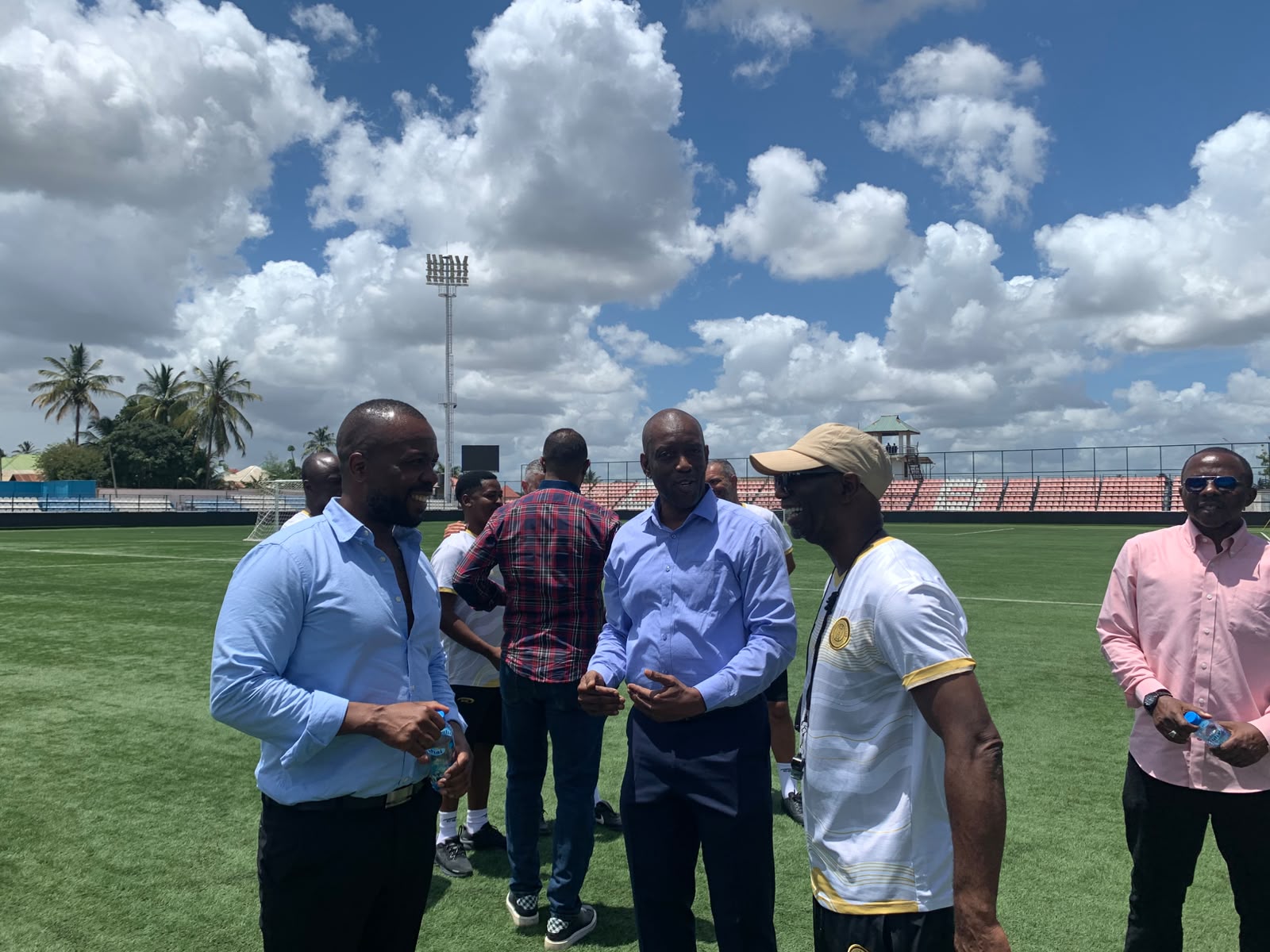Culture Manager Mike Chuma and Azam FC Head Coach Ibenge in conversation on the pitch at Azam FC